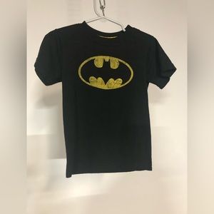 Batman tee 2T. Hardly worn. The wear on the logo is how the shirt is designed.